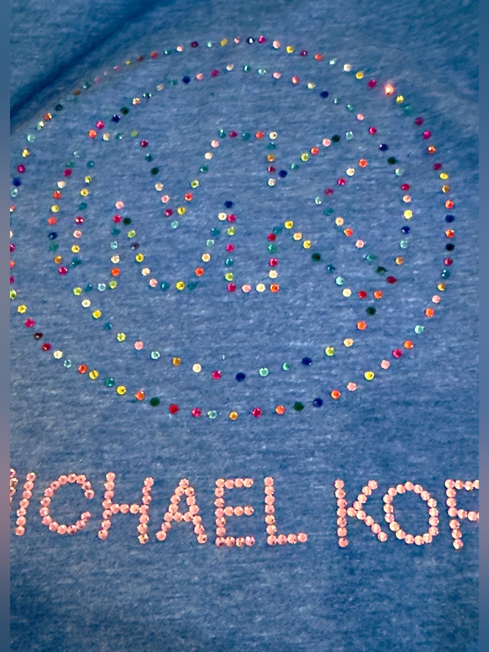 Blue V-Neck Tee with ruffle puff sleeves. Multicolor crystal MK Design